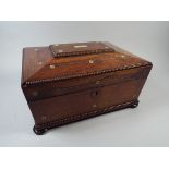 A Victorian Rosewood Ladies Work Box with Mother of Pearl Inlay.