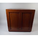 An Edwardian Mahogany Collectors Cabinet with Seven Graduated Shelves.