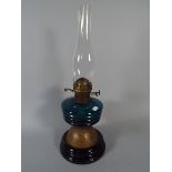 A Late Victorian Oil Lamp with Blue Glass Reservoir.