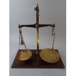 A Set of Brass Pan Scales on Wooden Plinth.