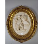 A Reproduction Gilt Framed Oval Plaque Depicting Children.