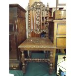 A Carved Oak Gothic Revival Hall Side Chair with Barley Twist Supports