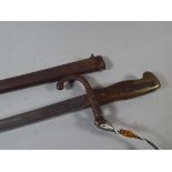 A Brass and Wooden Handled Bayonet and Metal Scabbard No: 48322