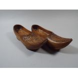 A Pair of Wooden Carved Norwegian Clogs.