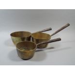 Three Graduated 19th Century Copper Pans.