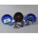 A Collection of Three Caithness Paperweights and A Stone Seal and One Other Smaller Paperweight.