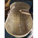 A Wicker Moses Basket.