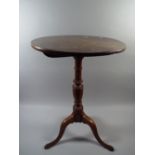 An Early 20th Century Elm Tip Top Tripod Table.