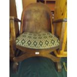 An Early 20th Century Leather Backed X Framed Tub Chair with Impressed Armorial to Back Rest
