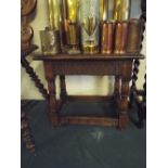 An Early 20th Oak Topped Joint Stool.