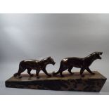 A Continental Art Deco Spelter Figure Group of a Stylised Pair of Leopards on a Sloping Marble Base.