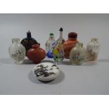 A Collection of Chinese Snuff Bottles to Include Glass Stone and Ceramic Examples.