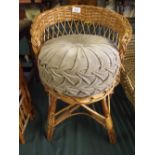 A Wicker Child's Seat With Cushion.