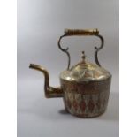 An Early 20th Century North African Brass Kettle with Applied Copper and White Metal Decoration.