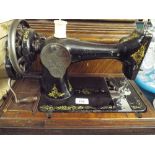 An Early to Mid 20th Century Singer Sewing Machine.