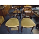 Two Mahogany Balloon Back Dining Chairs with Carved Back Detail and Turned Supports.