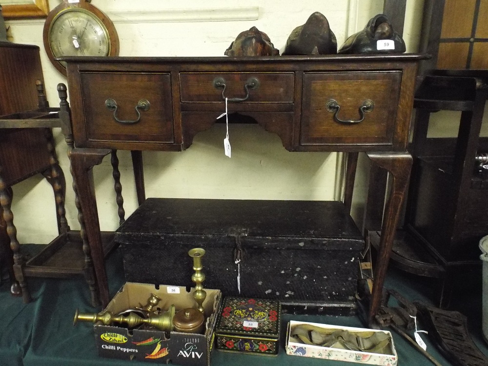 A Reproduction Oak Low Boy with Three Cross Banded Drawers on Cabriole Supports.