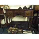 A Reproduction Oak Low Boy with Three Cross Banded Drawers on Cabriole Supports.