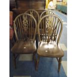 Four Oak Wheel Back Dining Chairs.