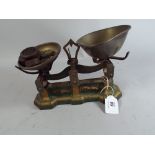 A Set of Vintage Kitchen Scales with Weights.