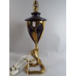 An Interesting Table Lamp with Brass Mounted Vase Top Supported by Brass Cobra.