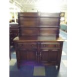 An Early 20th Century Oak Dresser with Two Short Drawers over Cupboard Base and Plate Rack Back.