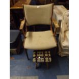 A 1970's Teak Arm Chair and Stool.