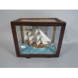 A Cased Model of A Three Masted Sailing Ship.