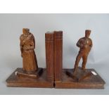 A Pair of Continental Carved Wooden Bookends, Probably Dutch, in The Form of Husband and Wife.