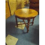 An Early to Mid 20th Century Oak Circular Occasional Table.