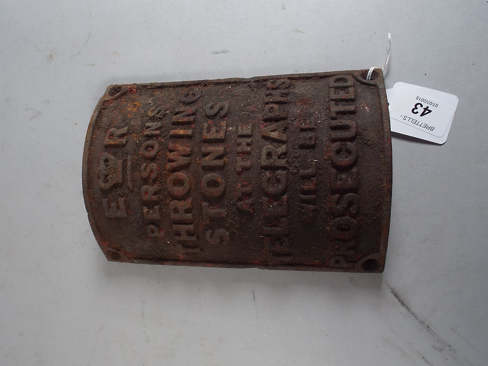 A Telegraph Pole Sign, "Person's Throwing Stones at The Telegraphs Will Be Prosecuted".