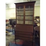 A Victorian Writing Bureau Bookcase with Three Long Drawers Short Cabriole Legs String Inlaid and