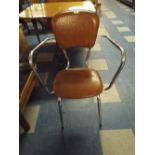 A 1970's Chrome Kitchen Chair with Leather Effect Upholstery.