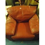 A Large Red Leather Arm Chair.