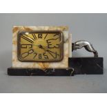 A French Art Deco Marble Mantle Clock with Chromed Ram Mount.