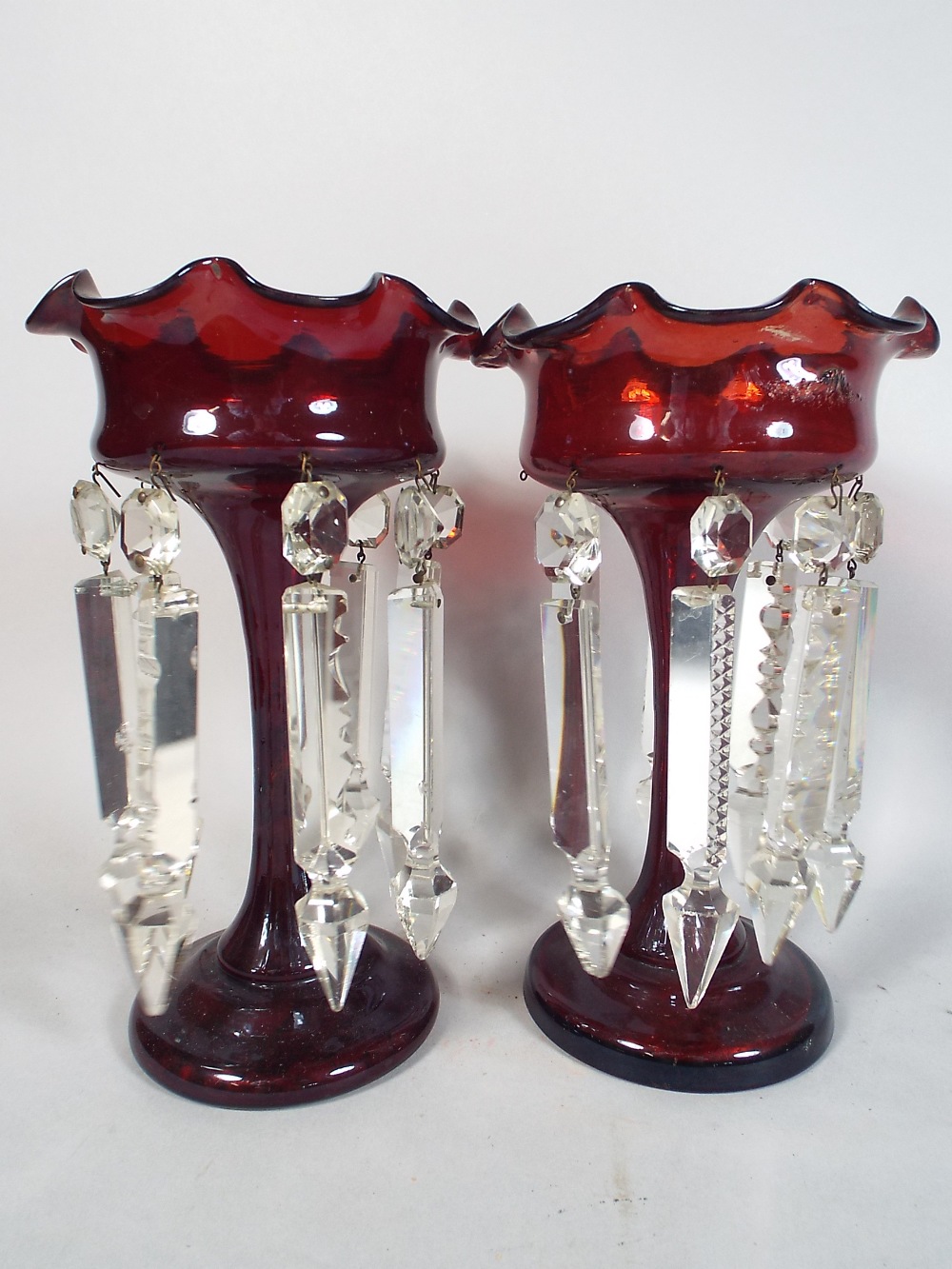 A Pair of Ruby Glass Lusters with Plain Droppers (Missing Two).