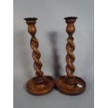 A Pair of Oak Barley Twist Candle Sticks.