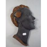 A 1950's Plaster Wall Hanging Plaque of A Maidens Head.