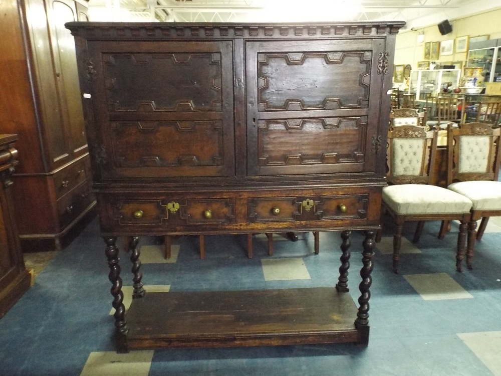 A 19th Century Oak Cabinet with Paneled Doors to Shelved Interior Two Base Drawers Barley Twist