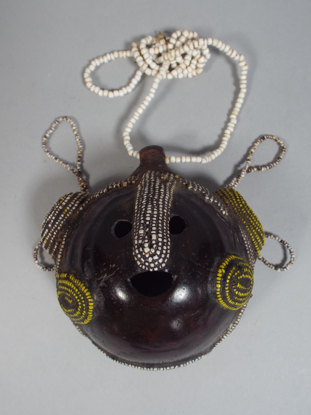 An East African Male Wedding Necklace Formed From a Nut Shell with Various Coloured Glass Bead