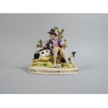 A 19th Century Ceramic Figure of a Goat Herder Surrounded by his Goats,