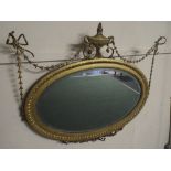 A Good 19th Century Adam Style Gilt Oval Wall Mirror with Ribbon and Swag Decoration.