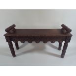 A Late Victorian Carved Oak Window Seat with Turned Stops.