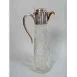 A Silver Mounted Etched Glass Claret Jug. The Body Decorated in Typical Vine and Grape Motif.