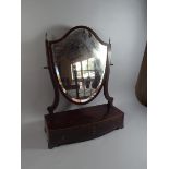 A 19th Mahogany Shield Shaped Toilet Mirror on Plinth Base with Three Drawers. 68cm High.