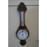 A Late Victorian Oak Onion Top Wheel Barometer of Aneroid Type with Temperature Scale and Carved