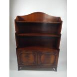 A Reproduction Mahogany Waterfall Bookcase with Cupboard Base.