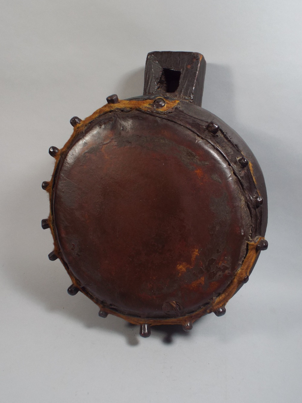 An Interesting and Rare African Tribal Drum of Kettle Form with Hanging Loop. 62cm High 62cm High.