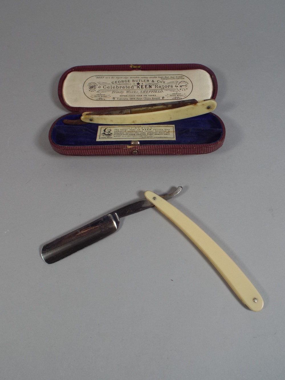 A Pair of Cased Cut Throat Razors by George Butler and Co