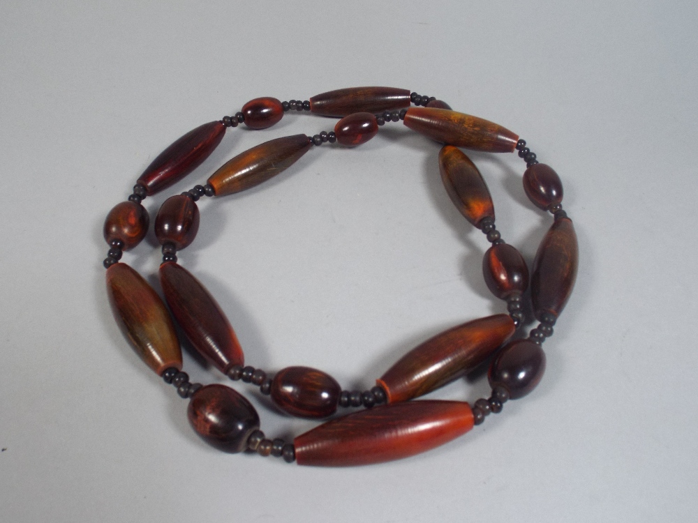 A Long String of African Horn Beads.